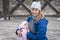 Mother breastfeeding her newborn baby girl in the park