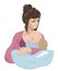 Mother breastfeeding infant baby child lulling him asleep on the nursing pillow like in cradle.