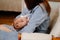 Mother breastfeeds a newborn at home on the couch. the benefits of breastfeeding