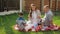 Mother with brown hair sits with handsome father and boys