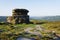 Mother Cap gritstone outcrop stands high on Surprise View overlooking a misty Derbyshire