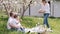 Mother carrying homemade cake to family picnic outside