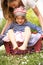 Mother Carrying Son Sitting In Laundry Basket