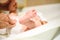 Mother changing diaper to baby, bare foot of her baby