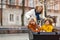 Mother checking on her children who is riding in a cargo bike