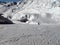 Mother and child alone on a sunny ski slope.