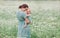 Mother and child in a chamomile field in summer. Maternal love tenderness care. Motherhood is happiness emotionally. Natural eco.