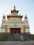 Mother and child climb the long stairs to the Buddha temple