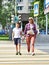 Mother and child on crosswalk street