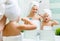 Mother and child daughter brush their teeth with toothbrush