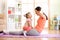 Mother and child daughter are engaged in fitness, yoga, exercise at home. Kid and woman swing press on stomach.