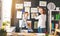 Mother and child girl hang their drawings on wall