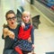 Mother and child on Halloween at mall pointing at something