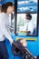 Mother With Child In Pushchair Boarding Bus