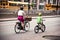 Mother and child riding bikes in Toronto city