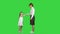 Mother and child shake hands on a green screen, chroma key