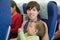 Mother and child traveling on airliner