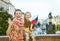 Mother and child travellers with Czech flag handwaving