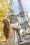 Mother and child travellers looking on Eiffel Tower in Paris