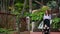 Mother and child walk around the waterfall during a tour of the Canary Islands