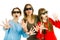 Mother with children with 3D cinema glasses - scared watching performance - gestures of astonishment