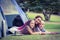 Mother and children camping in the park