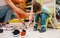 Mother with children choosing shoes in kids store