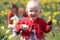 Mother And Children In Daffodil Field