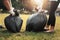 mother and children keeping garbage black bag at park in morning light