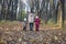 Mother And Children Walking In Park