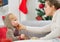 Mother cleaning eat smeared baby eating cookies