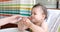 Mother cleans and wipes baby's mouth after eating with baby wipe