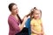 Mother is combing a little girl