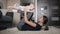 Mother with cute baby doing gymnastic exercise at home