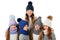 Mother and cute kids in winter warm hats and scarfs on white. Children winter clothes