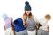 Mother and cute kids in winter warm hats and scarfs on white. Children winter clothes