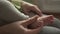 A Mother cuts fingernails of a Baby