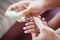 Mother cutting fingernails for her baby