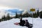 A mother and daugher at Bowen Lookout on Cypress Mountain feeding the birds and enjoying lunch overlooking Howe Sound, B.C.