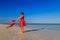 Mother and daugher playing on summer beach