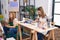 Mother and daughter artists smiling confident drawing at art studio