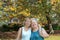 Mother and daughter in autumn garden