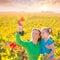 Mother and daughter on autumn vineyard smiling holding grape