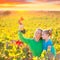 Mother and daughter on autumn vineyard smiling holding grape