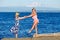 Mother and daughter on beach.