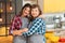 Mother daughter bond hugging kitchen time fun
