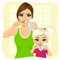 Mother and daughter brushing teeth