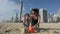 Mother and daughter builds sand castle in Surfers Paradise Australia