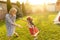 Mother and daughter chasing each other while playing blind man`s buff