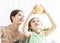 Mother and daughter checking the piggy bank for her future savings